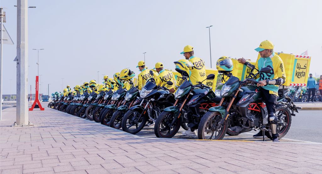 A fleet of YaBalash delivery motorcycles lined up in Abu Dhabi.